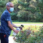 man spraying plants