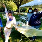 people at table creating a craft