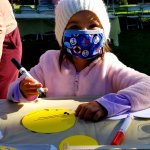 child using marker on craft