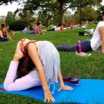 girl doing yoga pose on yoga mat