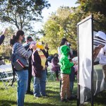 people gathered around honey bee event