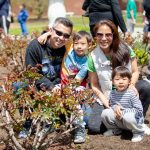 family smiling in garden