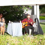 guitarist and singer playing live music outside