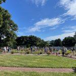 people walking around garden of Pinelawn