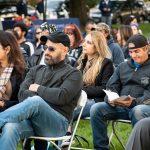 people sitting in chairs outside