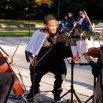 violinist playing live music with band