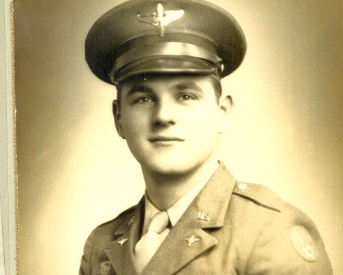 Old photo of man in military uniform with hat on