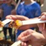 up close of fresh honey on a popsicle stick