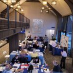group of people indoors at tables