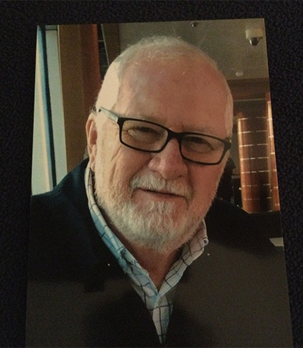 photo of old man in glasses smiling