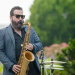 man playing a saxophone