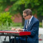 man playing keyboard piano