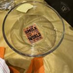 close up of a clear bowl with a quote decorated on it